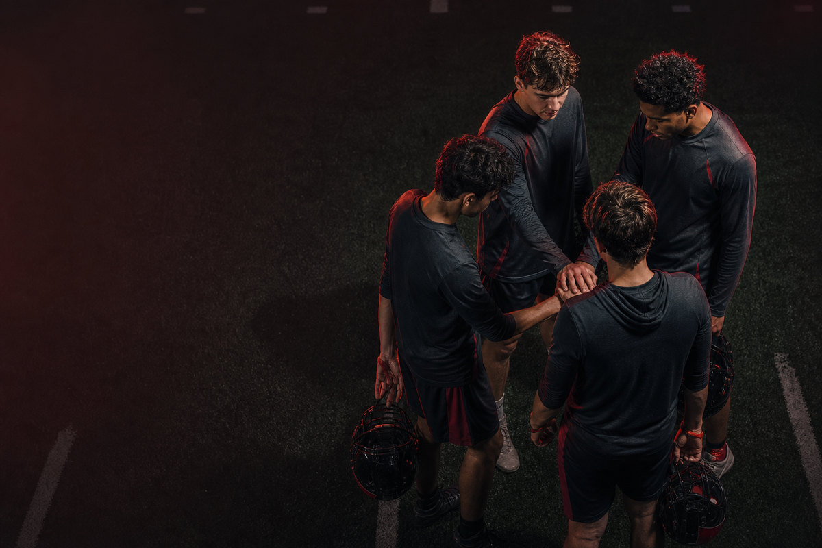Quarterback addressing teammates in the huddle